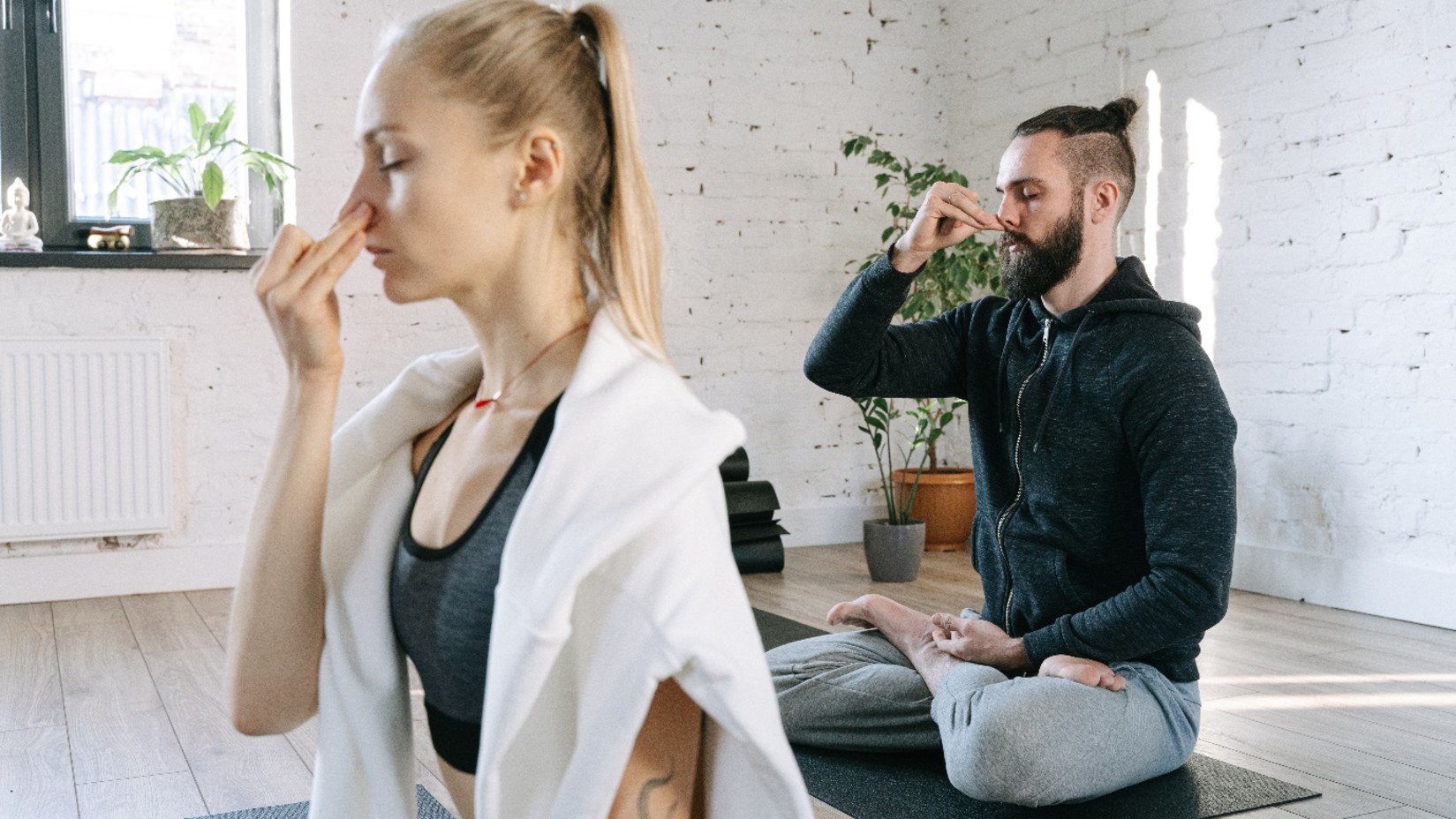 A couple practising a breathing technique - YO1 Longevity Health Resorts