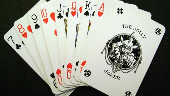 a deck of card spread on a table