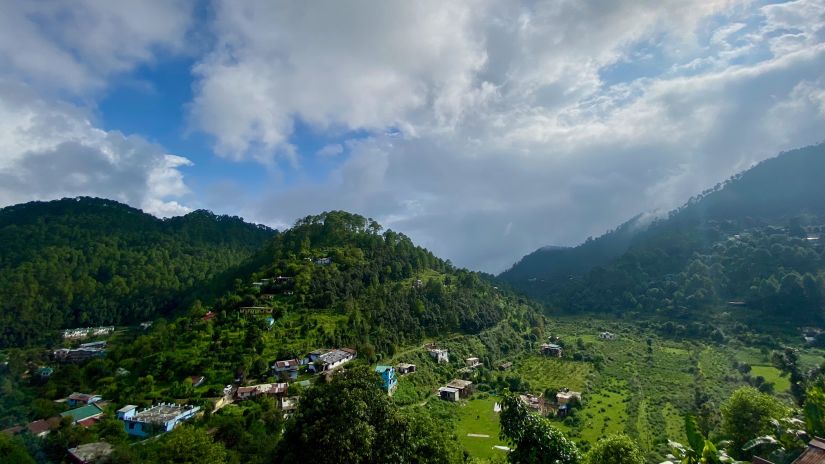 a bird-eye view of emerald green valleys