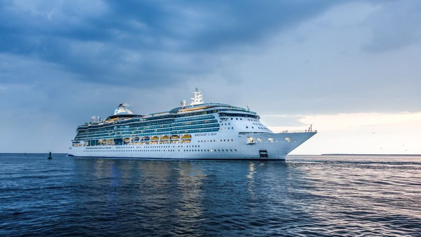 A cruise ship sailing in the sea with the backdrop of picturesque blue sky