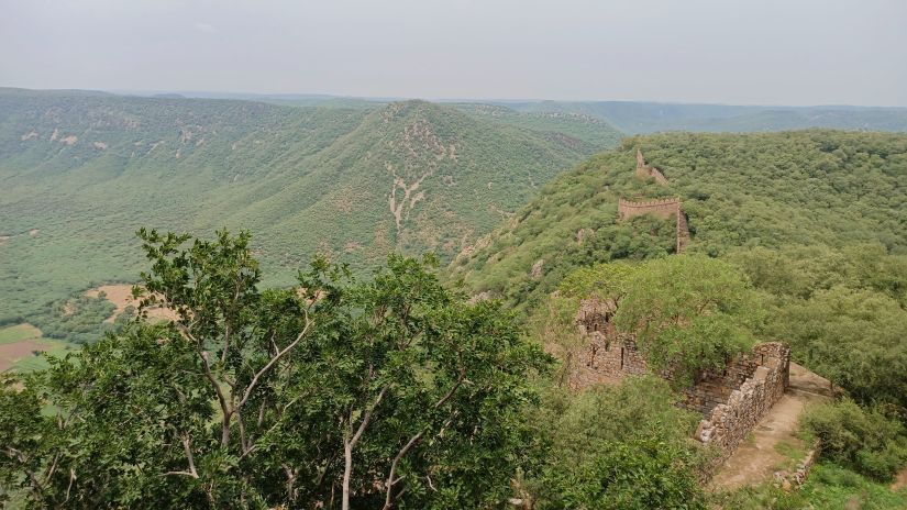 a cliff overlooking grasslands