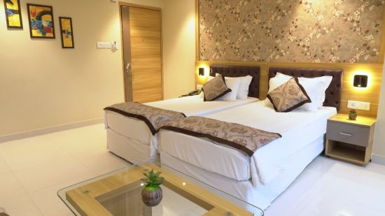 a view of premium room displaying double bed - Click Hotel Capital House, Patna