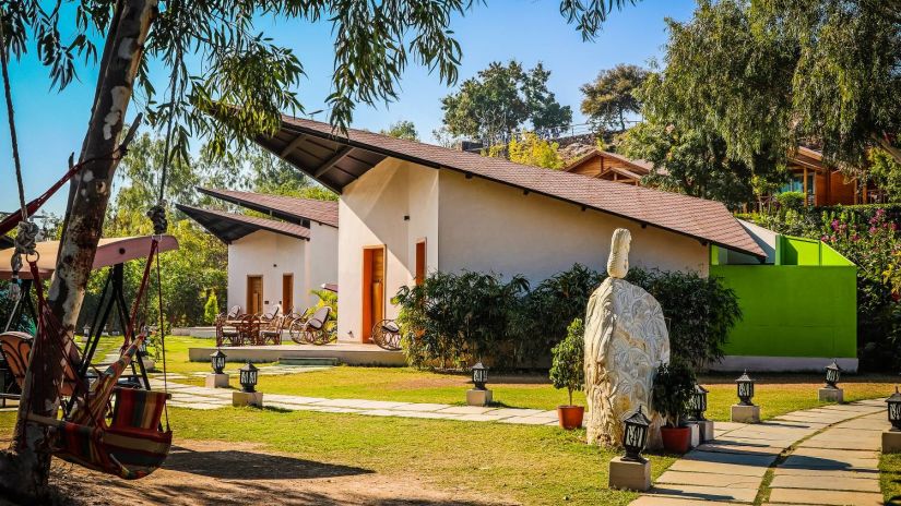 Patang Cottage View with garden and trees in front