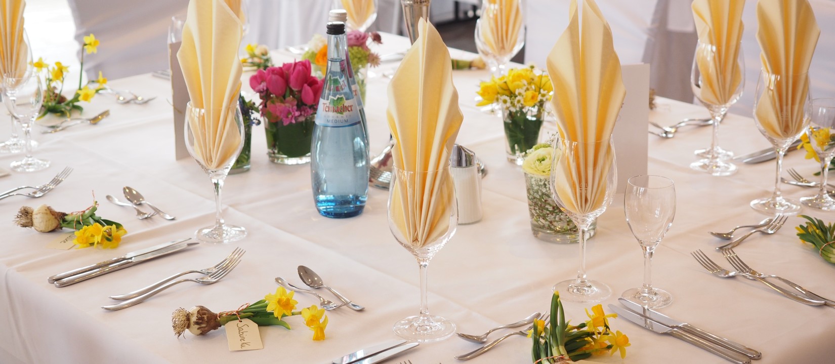 Banquet hall  with napkins and cutlery on the table at Chandertal Regency by Summit Spa Manali best hotels in manali