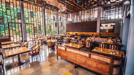 Restaurant interiors with wooden furniture at our hotel in Andaman