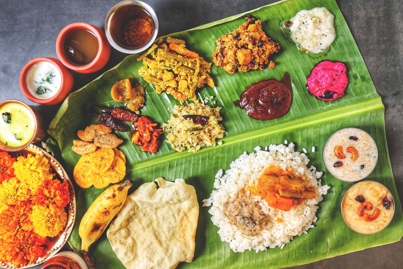 A complete Onam sadhya spread on a banana leaf