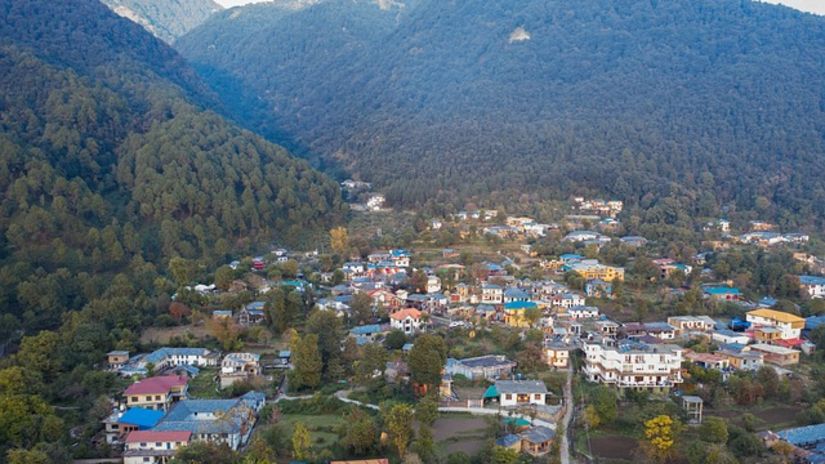 A village situated in the middle of lush green mountains