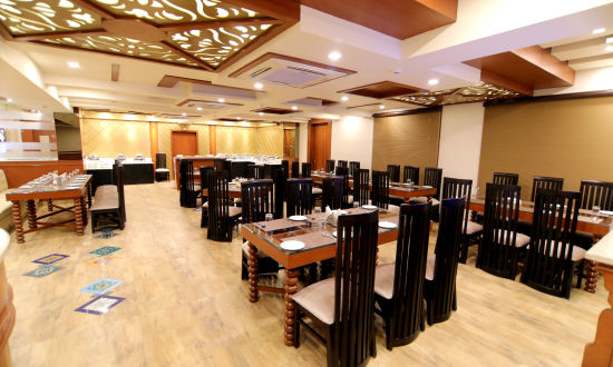 alt-text The seating arrangement at the Restaurant 3 - Udman Hotel Haridwar