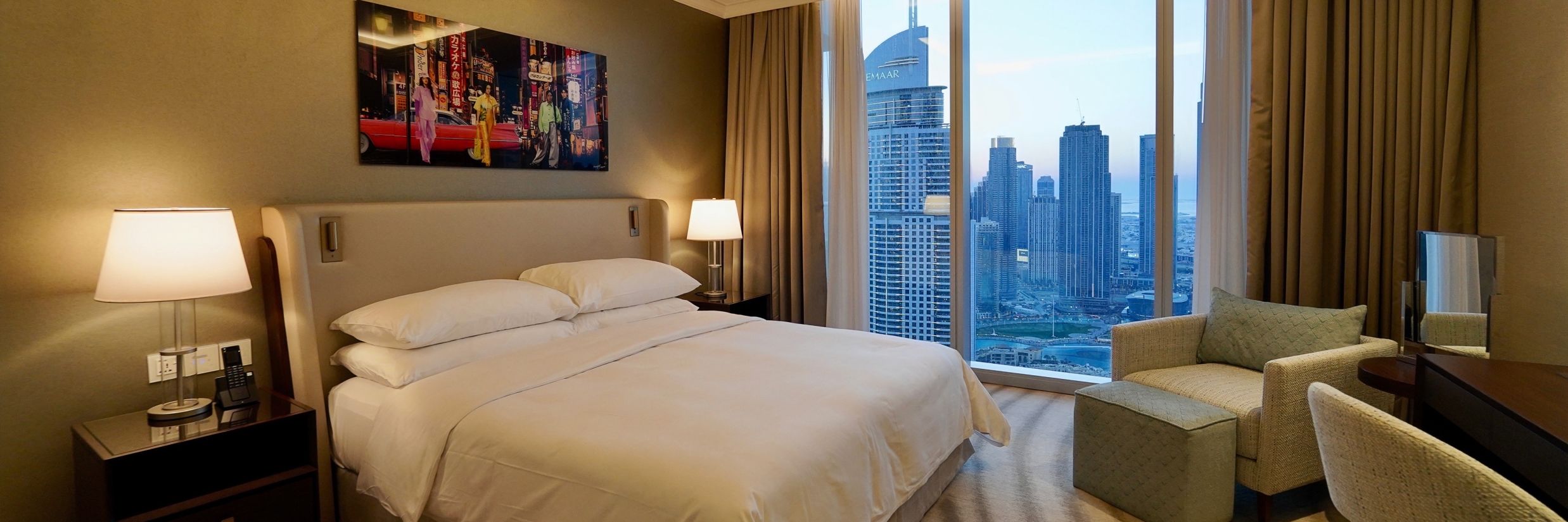 Address Dubai Mal(previously Address Fountain Views Residence Tower - the king size bed kept beside the window that overlooks Burj Khalifa during daytime