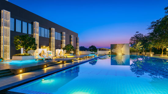 the Swimming Pool with evening sky in the background at Karma Lakelands