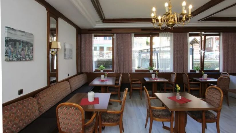 A shot of the dining area with tables and chair arranged in a organised way | Hotel Sonne by Mastiff, Bad Wildbad