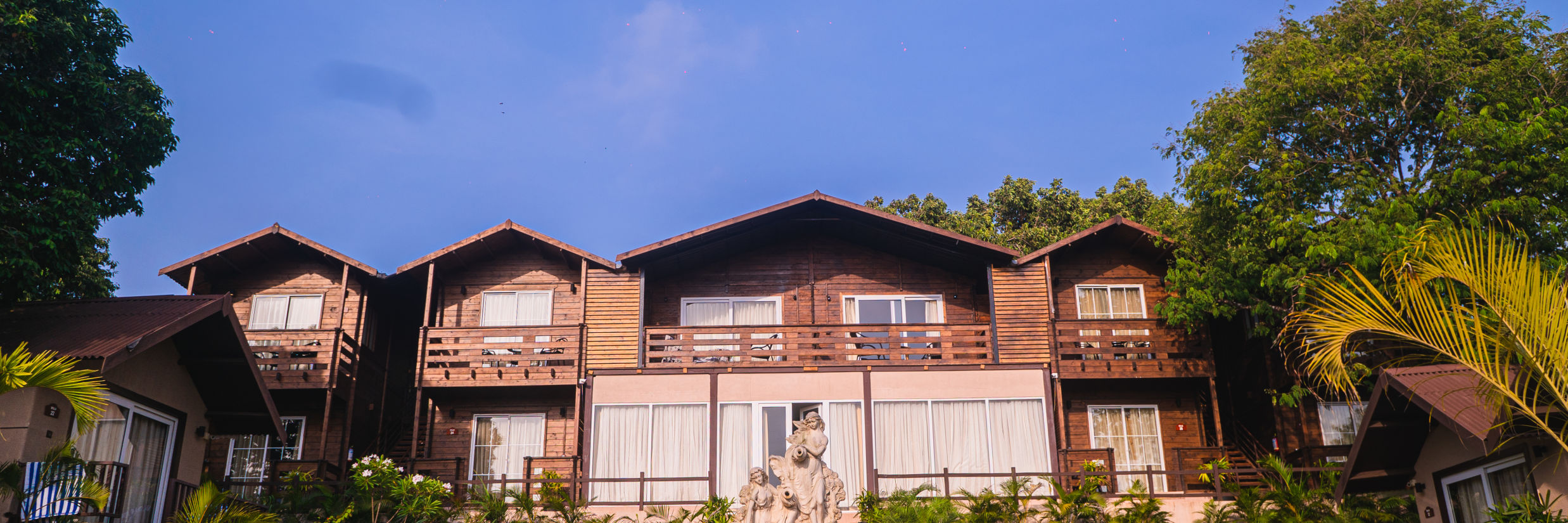 The panorama of our resort in Mandrem with the main cottages and trees in the premises 