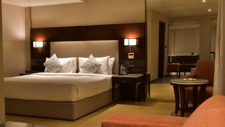 a double bed in one of our rooms in bangalore 1