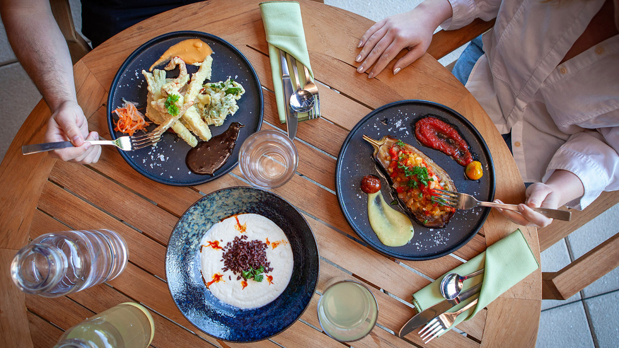 top view of 2 people dining healthy food on a table - YO1 Longevity Health Resorts Catskills