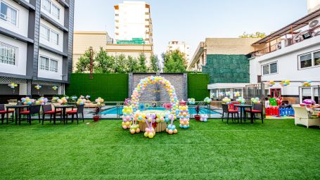 A wide view of an open event space beside a swimming pool Sun Park Hotel & Banquet, Chandigarh - Zirakpur