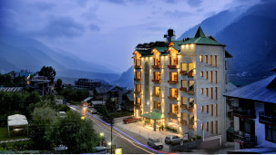 Night side view of the facade of  Chandertal Regency by Summit & Spa 