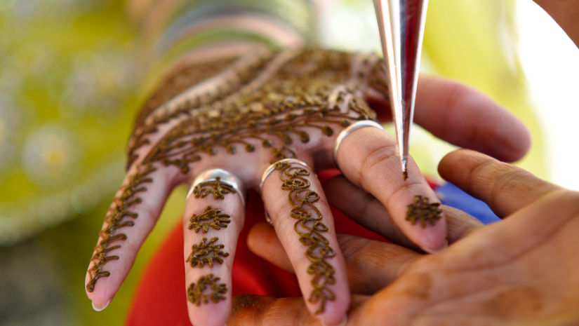 Deo Bagh - 17th Century, Gwalior - a woman getting mehendi on her hand