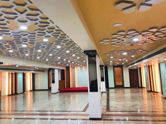 alt-text an empty Banquet Hall in Tirupati with many lights switched on - Raj Park Hotel, Tirupati