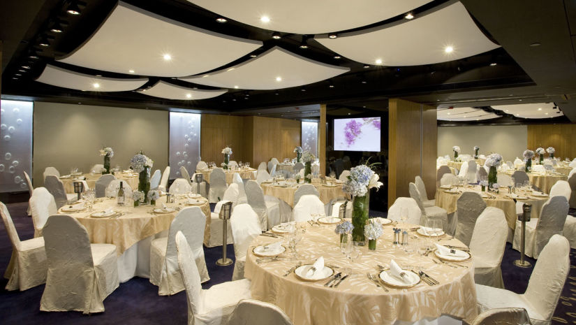 Dining arrangement at the banquet hall on a round table seating - Symphony Summer Sand Beach Resort And Spa, Neil island