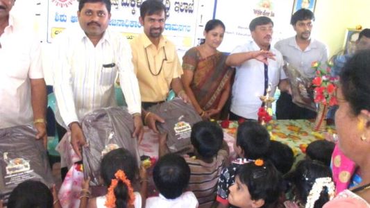 Students being gifted school bags