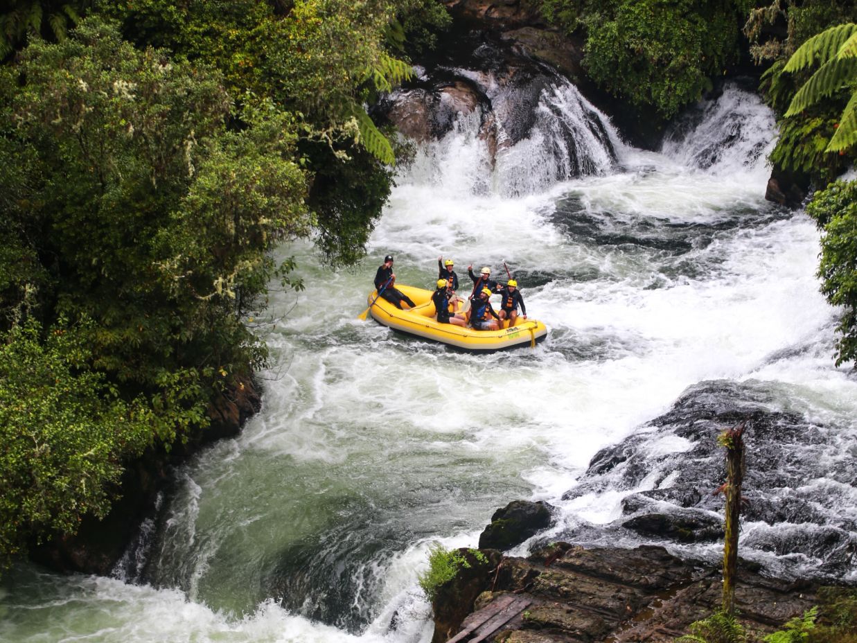 a group of people doing river rafting