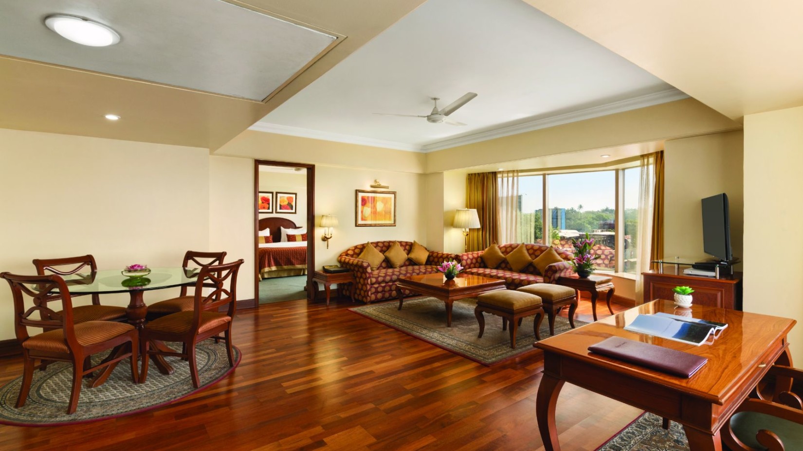 living room of the Deluxe Suite at Hotel Ramada Plaza Palm Grove Juhu Beach