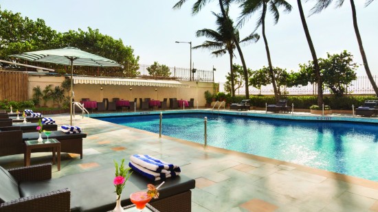 poolside patio at Ramada Plaza Palm Grove 34