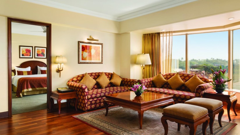 seating area in the Deluxe Suite at Hotel Ramada Plaza Palm Grove Juhu Beach