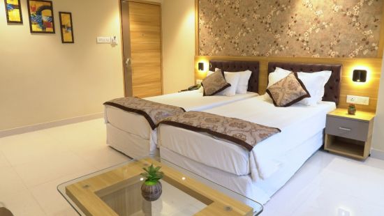 a view of premium room displaying double bed - Click Hotel Capital House, Patna