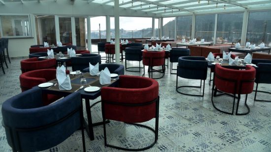 A different seating arrangement in The House of Glass, a rooftop restaurant in Shimla - The Orchid Hotel Shimla