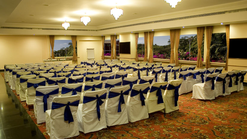 Ramanashree California Resort - interior view of the conference room with seats draped in satin cloth and bow