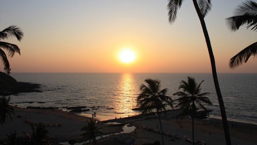 sunset on a beach in goa