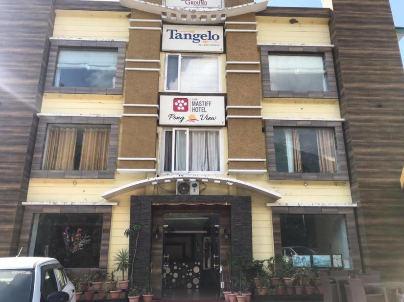 exterior of a hotel building that is shot from a lower angle during the day - Little Mastiff, Dharamshala