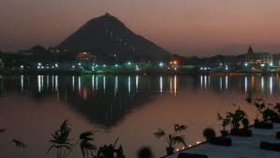 Savitri Temple's reflection lights up the lake in Pushkar 