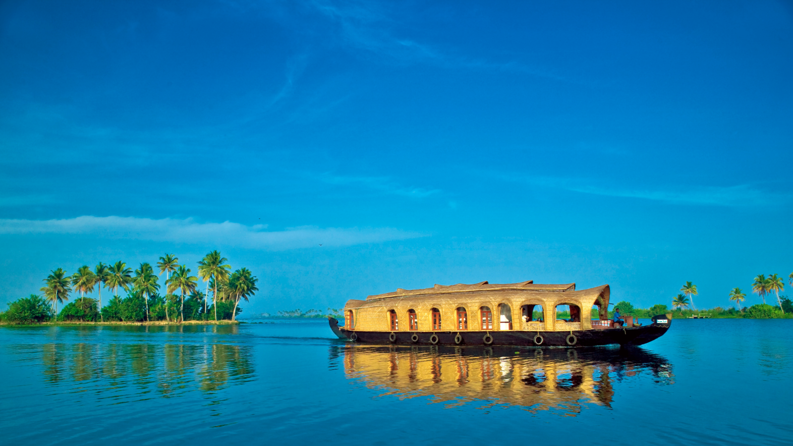 Houseboat on blue lake waters