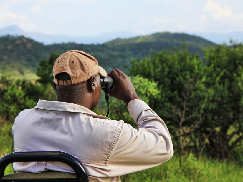 A man using binoculars