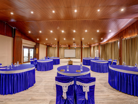 alt-text A spacious area with a round seating arrangement in the Conference Hall at Silver Sand Beach Resort, Havelock.