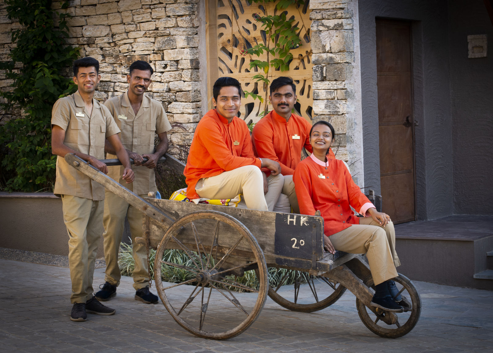 Staff Enjoying Sitting on Three Wheeled Cart