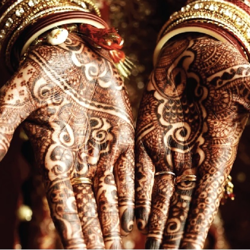 person showing off mehendi design