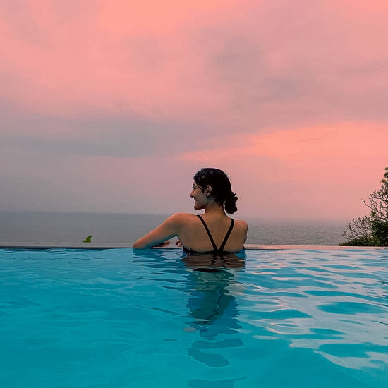 alt-text a woman chilling in the cintacor infinity pool