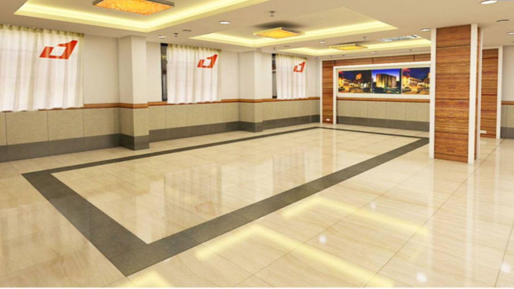 A spacious and well-lit hotel hallway leading to different rooms with pictures and branding on the walls.