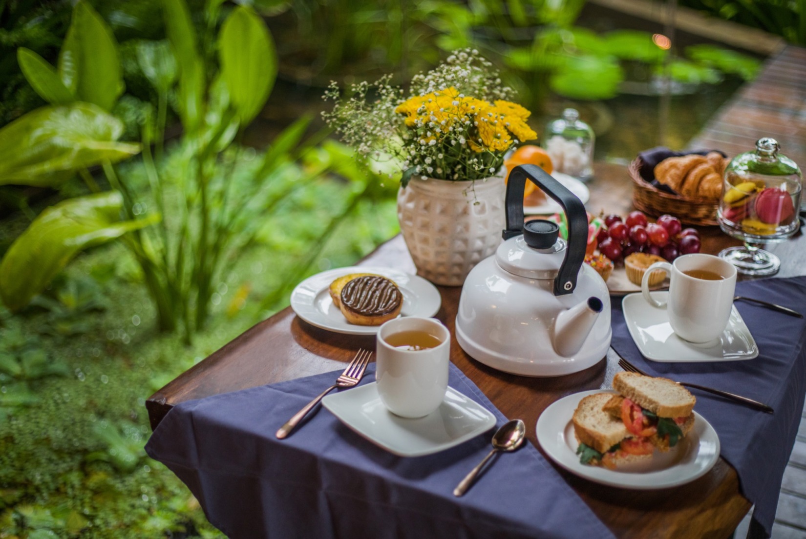 Food kept on a coffee table in the garden