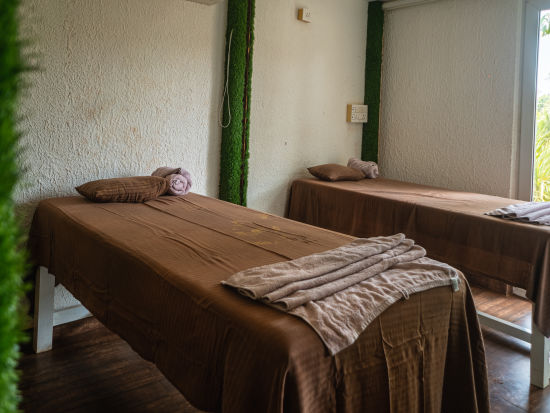 Two single beds placed inside our spa in Mandrem 