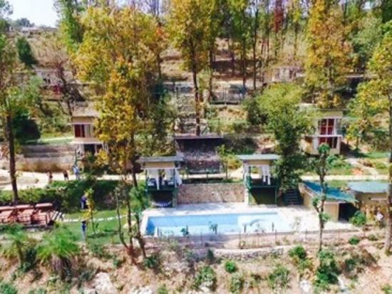 alt-text bird's eye view of swimming pool and gazebos at The Sal Woods Forest Retreat & Spa