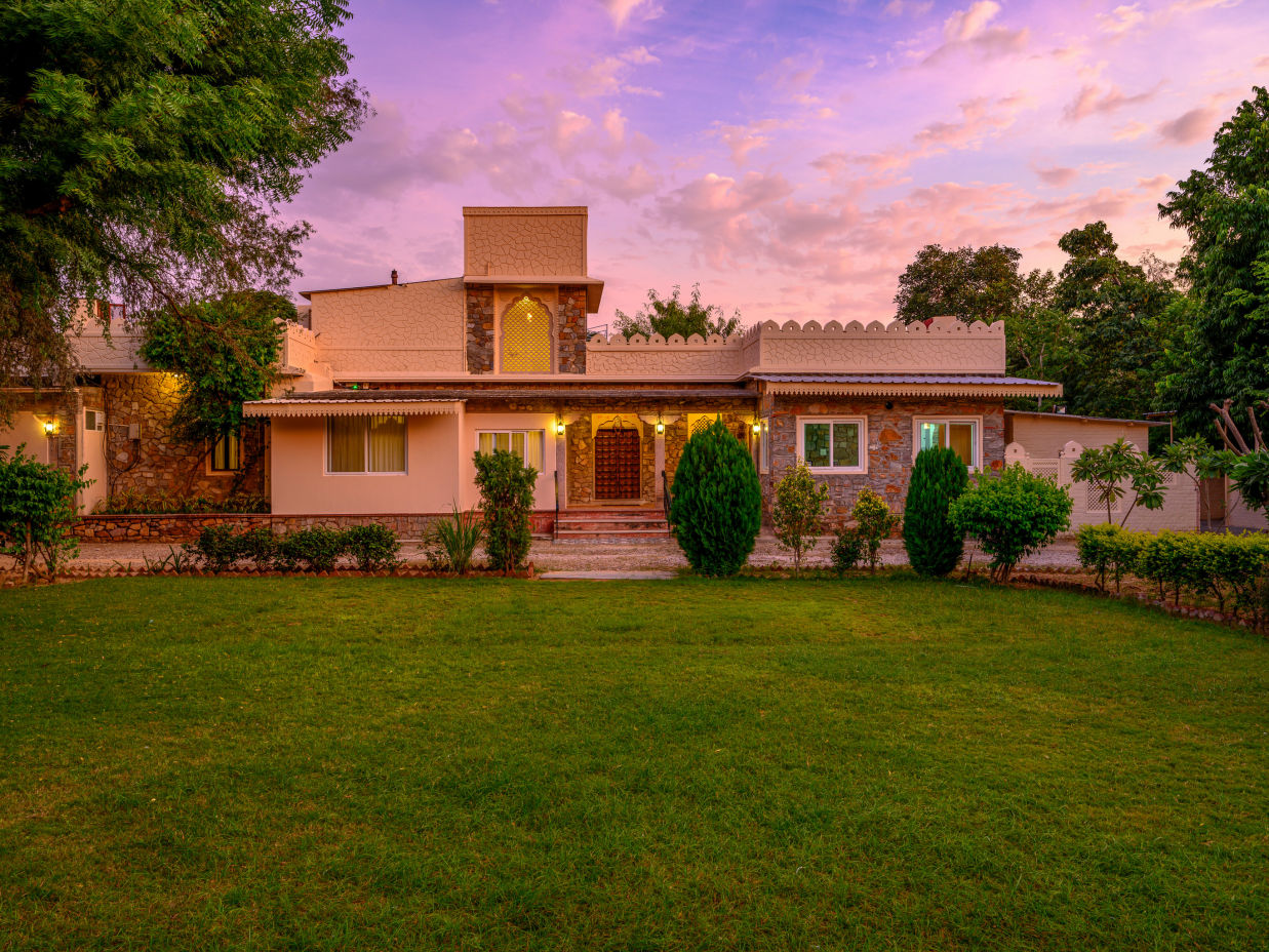 The Bagheera Jaipur - exterior view of our property featuring a lawn captured during sunset