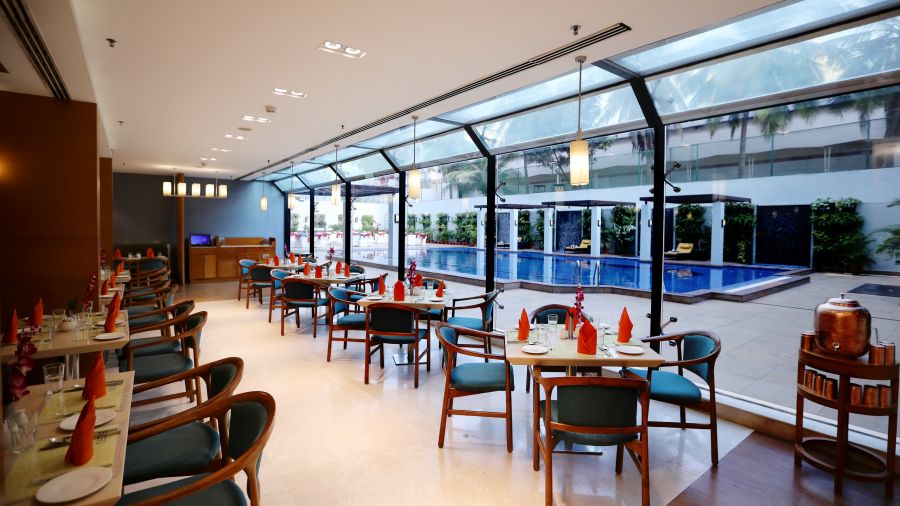 seating area overlooking the pool at Cascades restaurant in Vizag