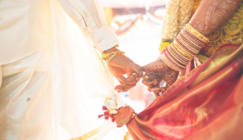 Bride and groom holding hands - Hablis Hotel, Chennai