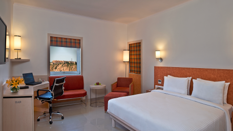 Studio Room Nahargarh View with plush bed, modern amenities - Nirwana Hometel, Jaipur