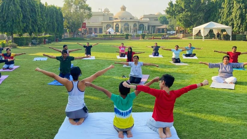 a yoga session on the lawns at Heritage village manesar 2