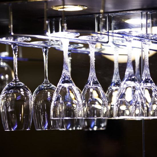 wine glasses hanging from a rack